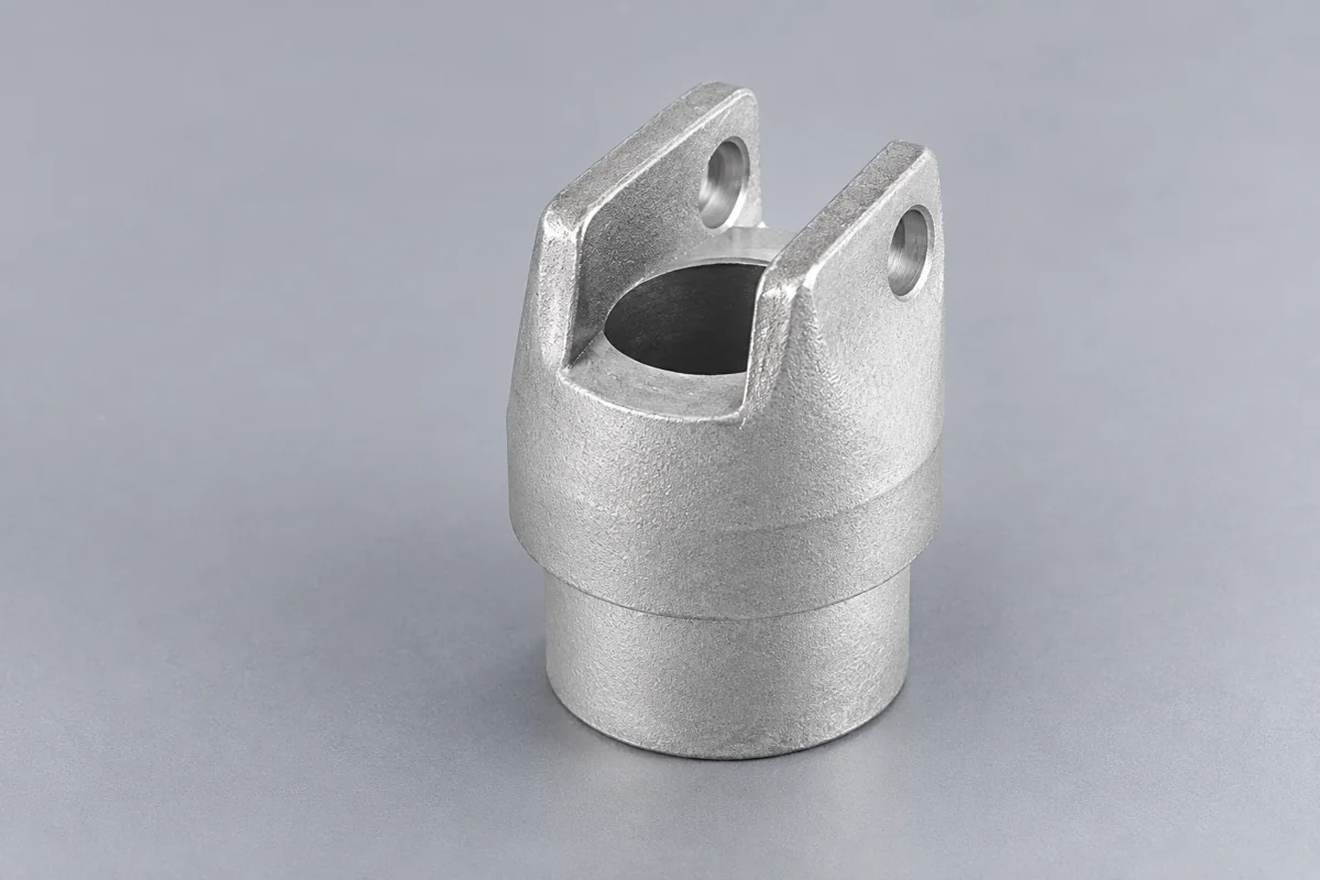 Cylindrical fork end with parallel arms and pin holes